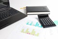 Part of laptop, calculator, diagrams, graphs, documents Royalty Free Stock Photo