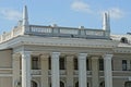 Part of a large gray old building with row columns Royalty Free Stock Photo