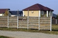 Part of a long rural fence of gray  wooden planks outdoors Royalty Free Stock Photo