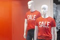 Part of a male mannequin dressed in casual clothes with the text sale in a shopping department store for shopping, fashion and adv