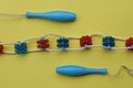 Part massager made of long rope and plastic red blue rollers