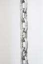 Part of metal chrome chain against light grey background Royalty Free Stock Photo