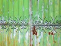 Part of a metallic green fence and gate Royalty Free Stock Photo