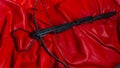 Part of modern compound crossbow handgun on the red background. Old weapon concept.