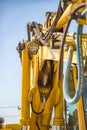 Part of modern yellow excavator machines. Royalty Free Stock Photo