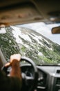 Part of a mountain covered with snow seen from the windscreen of a car Royalty Free Stock Photo