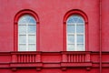 Part of the multistory red houses with Windows and balcony