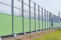 Part of the noise protection fence along the road. Royalty Free Stock Photo