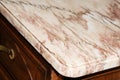 Part of an old chest of drawers with a marble surface Royalty Free Stock Photo