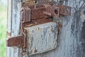 part of an old door with a brown rusty iron latch Royalty Free Stock Photo