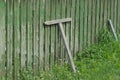 Part of an old green wooden fence with plank props Royalty Free Stock Photo