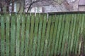 Part of an old green wooden plank fence wall Royalty Free Stock Photo