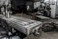 Part of an old horizontal milling machine of equipment and tools for metalworking in the workshop of an industrial plant Royalty Free Stock Photo
