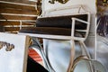 Part of an old metal carriage in a wooden shed. Seat in an old carriage Royalty Free Stock Photo