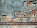 A part of a old rustic wall built with different types of construction bricks. Royalty Free Stock Photo