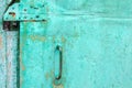 Part of an old shabby green door