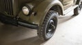 Part of the old soviet army car jeep. Restored retro car. Close-up