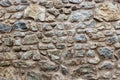 Part of old stone wall background. Rocks of different sizes and Royalty Free Stock Photo