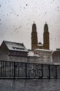 Part of old town in Zurich cower with snow with bicycle in photo