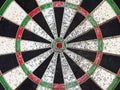 colorful grunge dartboard with red bullseye and porous caused by hard training Royalty Free Stock Photo