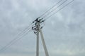 Part of a one gray concrete pillar with black wires