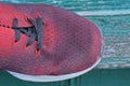 Part one red black dirty sneaker made of fabric Royalty Free Stock Photo
