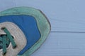 part of one sneaker made of green suede and blue fabric Royalty Free Stock Photo