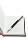 Part of opened notepad with pen. Isolated Royalty Free Stock Photo