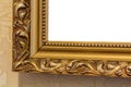 Part of the ornate, golden color carved mirror frame in ancient