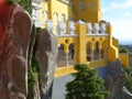 part of the palace of Pena de sintra with the ogival arches in yellow, Portugal Royalty Free Stock Photo