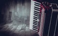 Part pink accordion on wooden grey background. Write text Royalty Free Stock Photo