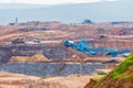 Part of a pit with big mining truck working. Coal mining at an open pit Royalty Free Stock Photo