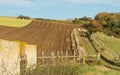 Part ploughed field on South Downs, Sussex, England Royalty Free Stock Photo