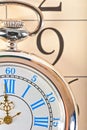 Part pocket watch lying on calendar Royalty Free Stock Photo
