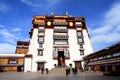 The part of the Potala Palace, with the people republic of China flag inside as well as many windows, curtain, Brick wall, Potala