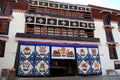 The part of the Potala Palace, with the people republic of China flag inside as well as many windows, curtain, Brick wall, Potala Royalty Free Stock Photo