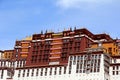 The part of the Potala Palace, with the people republic of China flag inside as well as many windows, curtain, Brick wall, Potala Royalty Free Stock Photo