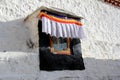 The part of the Potala Palace, with the people republic of China flag inside as well as many windows, curtain, Brick wall, Potala Royalty Free Stock Photo