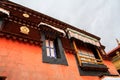 The part of the Potala Palace, with the people republic of China flag inside as well as many windows, curtain, Brick wall, Potala Royalty Free Stock Photo