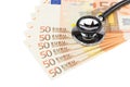 Part of professional stethoscope on euro notes Royalty Free Stock Photo
