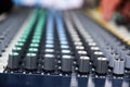 Part of a professional sound mixing console, studio music device for audio signals with controlling knobs Royalty Free Stock Photo