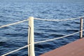 The part of the quay and the fencing with ropes from the water surface Royalty Free Stock Photo