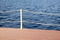 The part of the quay and the fencing with ropes from the water surface Royalty Free Stock Photo