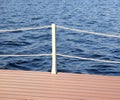 The part of the quay and the fencing with ropes from the water surface Royalty Free Stock Photo