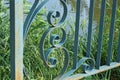 part of a railing design made of blue metal bars in a wrought iron pattern Royalty Free Stock Photo