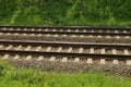 Part of the railroad with an iron rail and concrete sleepers Royalty Free Stock Photo