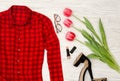 Part of a red checkered shirt, tulips, glasses, lipstick. Fashion concept, close-up Royalty Free Stock Photo