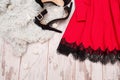 Part of red dress with lace and black shoes on artificial fur, fashionable concept Royalty Free Stock Photo