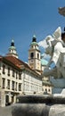 Ljubljana, Slovenia - 07/19/2015 - Part of Robba Fountain and Ljubljana Cathedral, sunny day