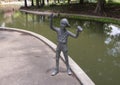 Part of a sculpture group at the Nortel Corporate Headquarters in Richardson, Texas, featuring boys with a handmade walkie-talkie. Royalty Free Stock Photo